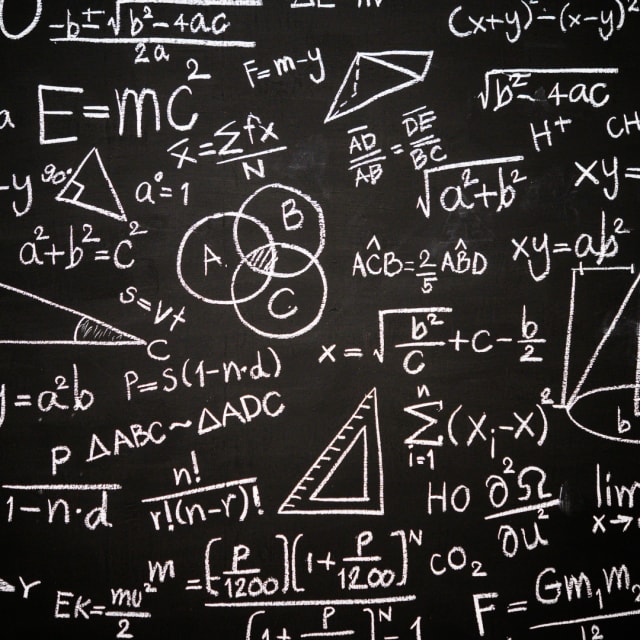 blackboard with equations, graphs, numbers