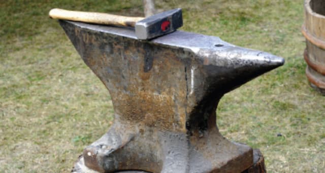 anvil with hammer on top.