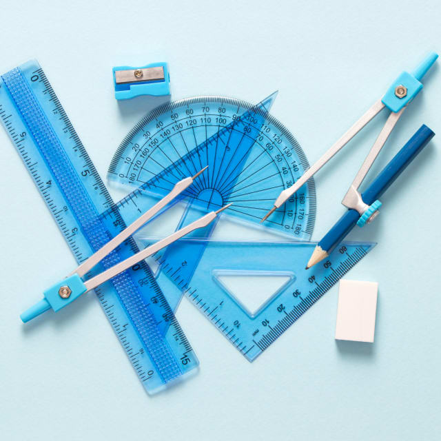 math equipment including ruler, protractor, angles, and pencils