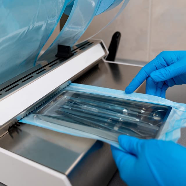set of surgical tools going through a cleaning machine
