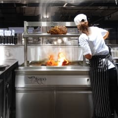 Chef cooking on Asado wood fired grill image