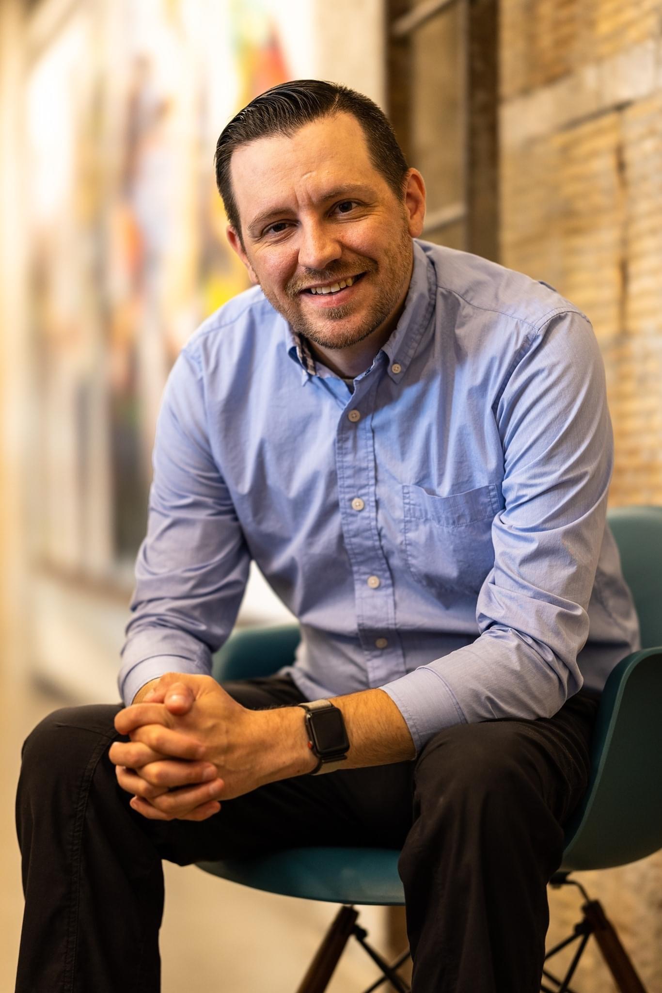 Jasen Wyatt sitting at the office.