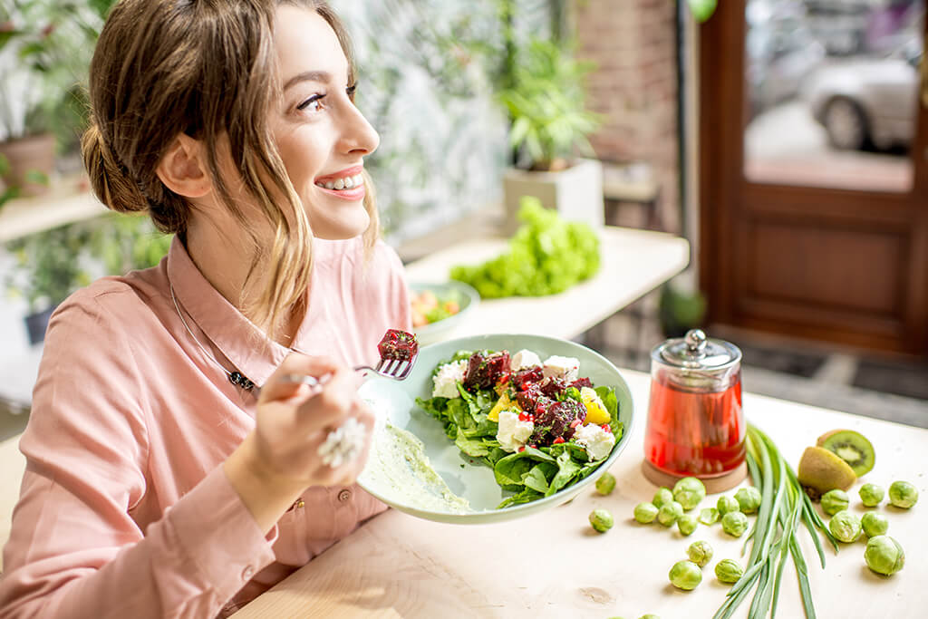 Veg girl eating salad