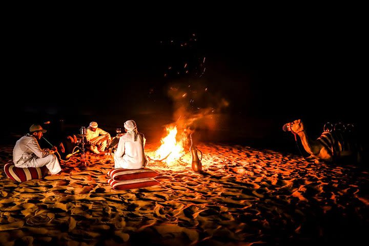 Overnight Desert Safari with Dune Bashing, Belly Dance, Camel Ride and Breakfast image