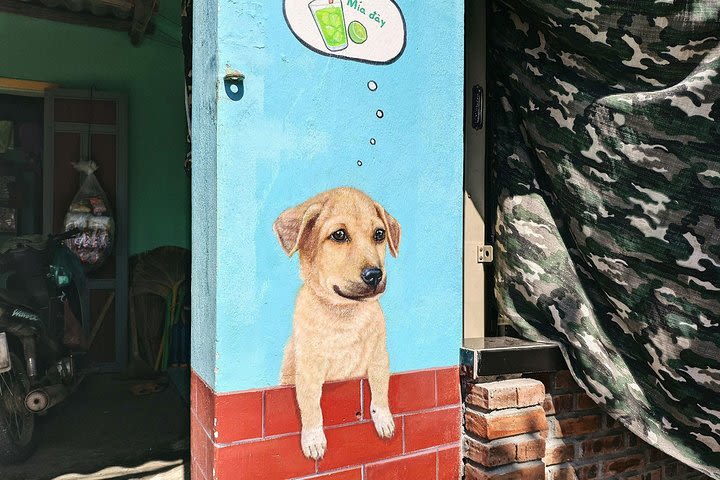 Visiting Tam Thanh mural village - Mother Thu monument image