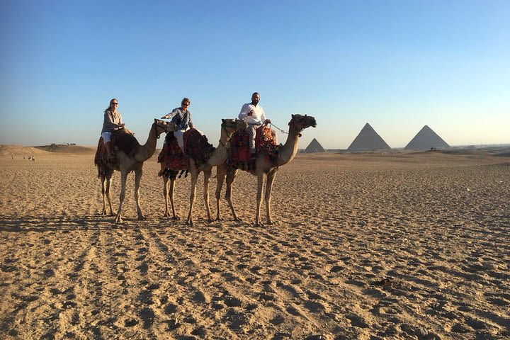 Explore The Pyramids Of Giza With Camel Ride image