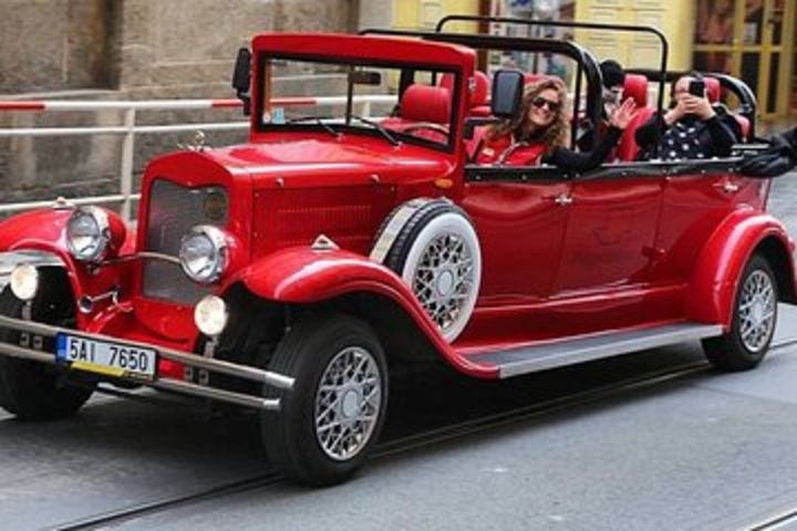 Karlstejn Castle in Vintage Convertible Car image