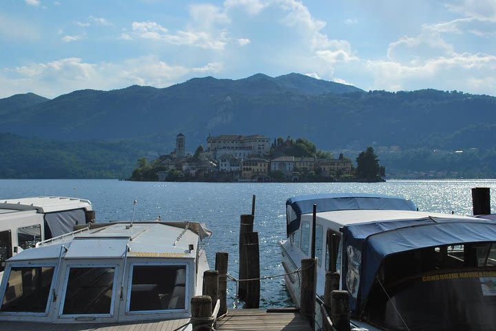 The romantic village of Orta San Giulio with a tour guide image