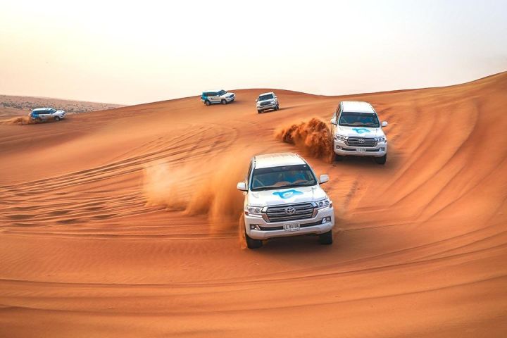 Morning Desert Safari with Camel Ride and Sandboarding in Abu Dhabi image