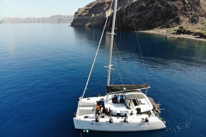 Half-Day Exclusive Catamaran Cruise in Santorini with Meal and Open Bar image