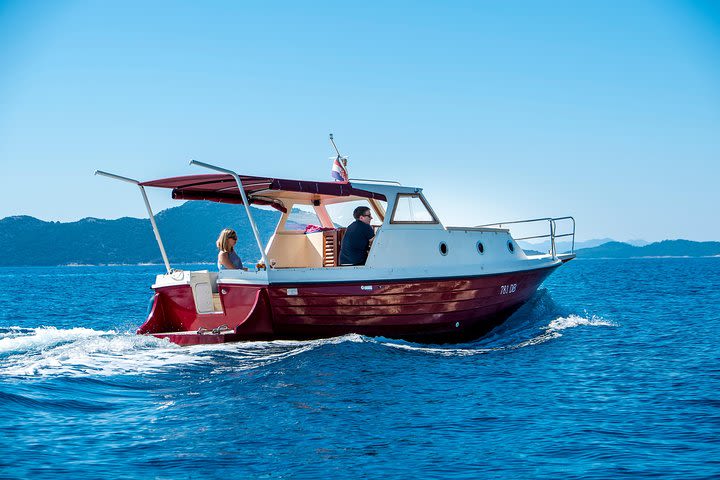 Private boat tour- explore the islands, find hidden caves and try snorkelling  image