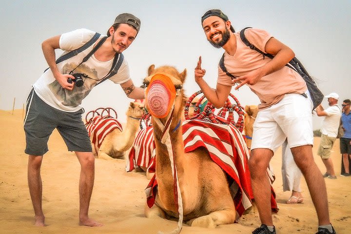 Abu Dhabi: Desert Dune Drive with ATV Bikes, Sandsurf, Camels, and BBQ image