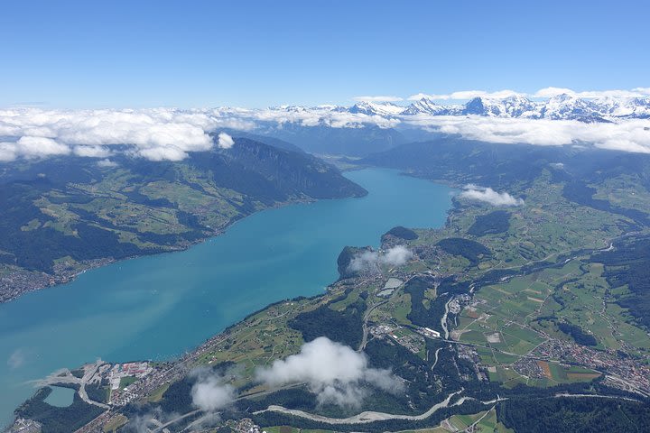 Helicopter tour over the lake Thun – see the beautiful play of colors from above image