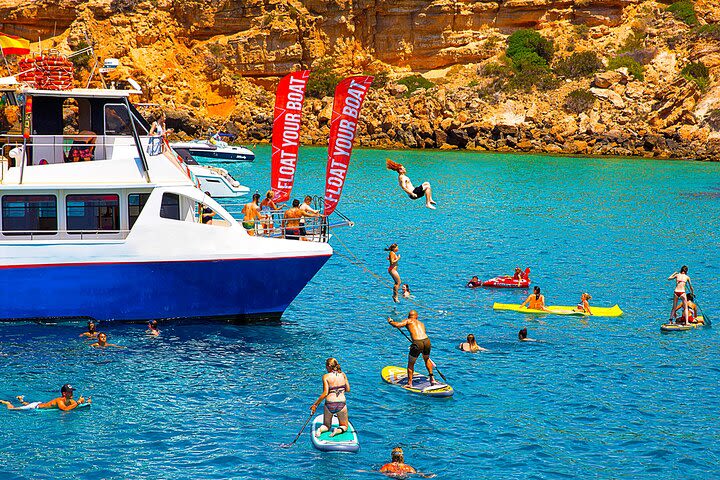 Cala Conta and Cala Bassa Beach Cruise with Paddle Surf, Snorkel and Drinks  image