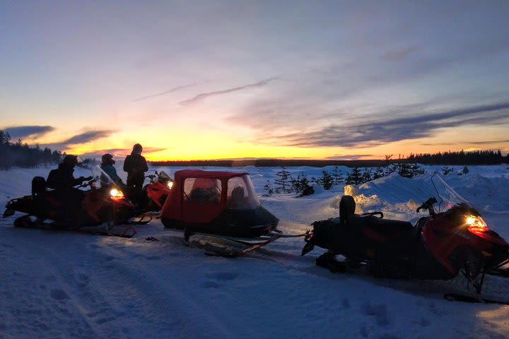 Northern lights hunting by snowmobile (private tour) image