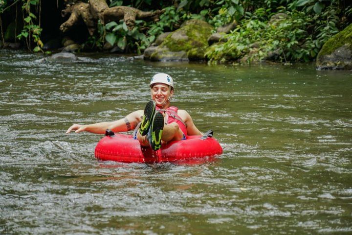 Arenal volcano tubing tour (class 1 and 2) + hot springs included image
