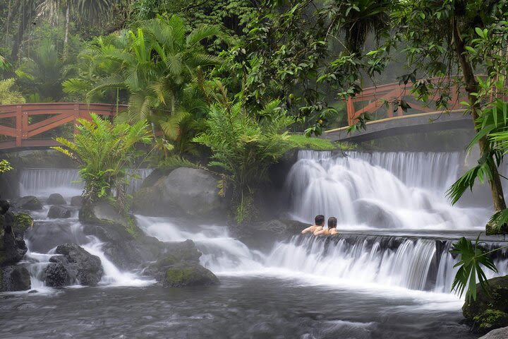 4-in-1 Arenal Volcano Tour: Hanging Bridges, La Fortuna Waterfall, Volcano Hike, and Tabacon Hot Springs image