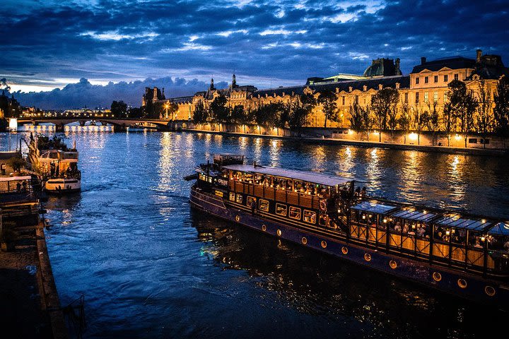 Paris By Night with Seine River Cruise and Roundtrip Luxury Transportation image