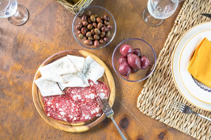 Dining experience at a local's home in Lucca with show cooking image