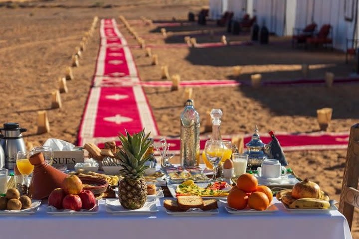 Merzouga: Overnight in Luxury Desert Camp with Camel Ride, meals & sandboarding image