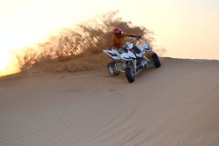 1 HR Self Drive Quad Bike , BBQ Dinner, Sand Boarding, Camel Ride & 3 Live Shows image