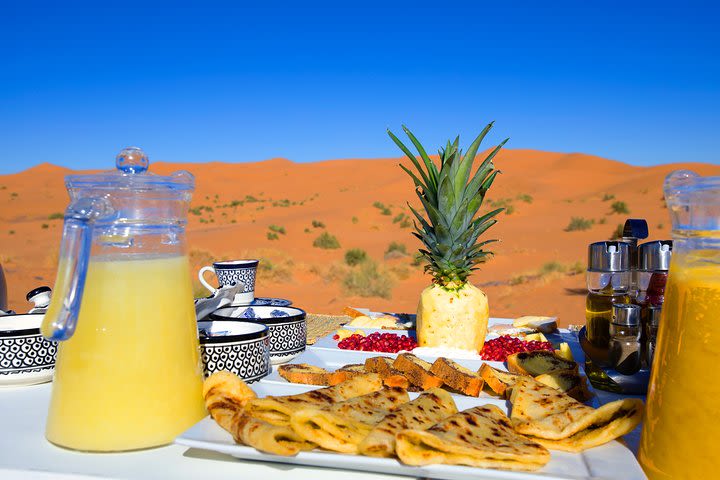 Merzouga: Overnight in Royal Desert Camp with Camel Ride, meals & sandboarding image