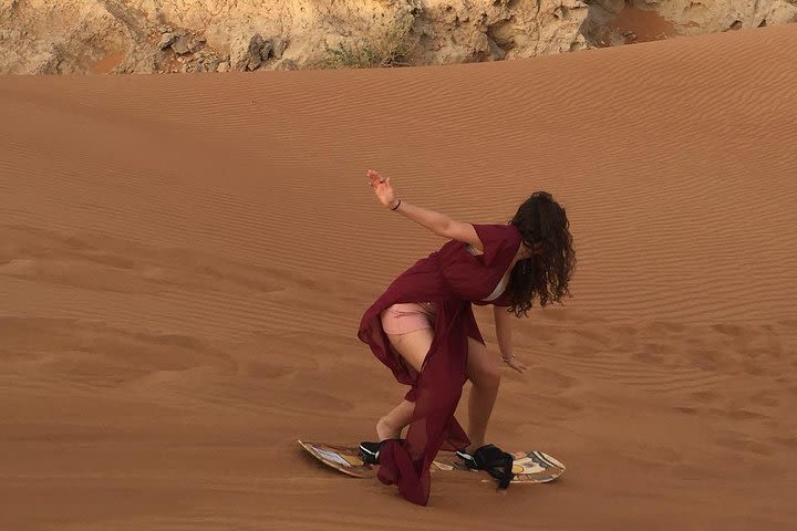 High Red Dunes with Camel Ride, Sandboarding, Falcon Show and VIP BBQ Dinner image