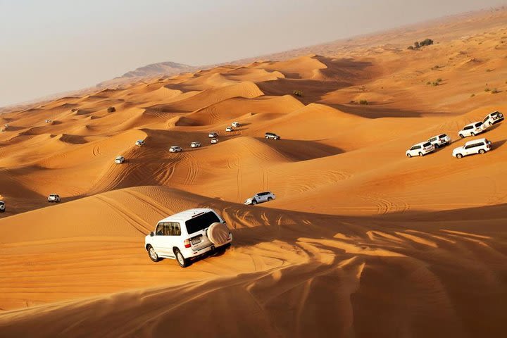 Morning Desert Safari with Quad Bike, Sand Boarding & Camel Ride image