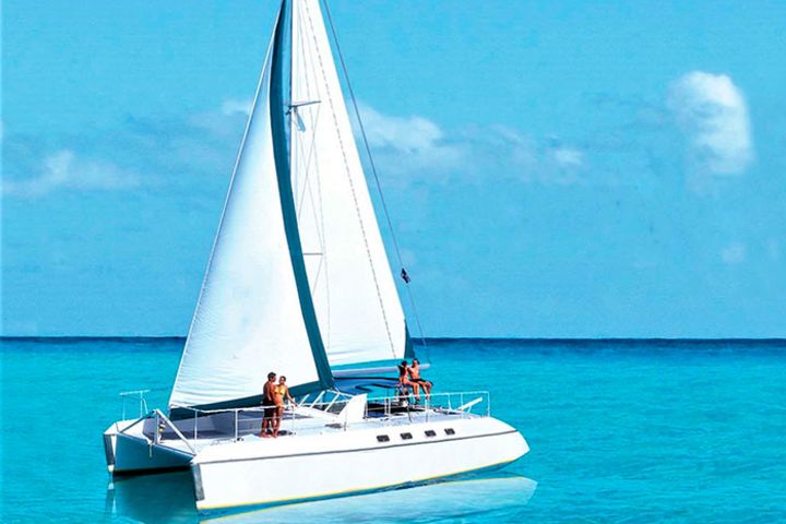 Full Isla Mujeres, Sail on a Catamaran + Snorkel + Dolphins image