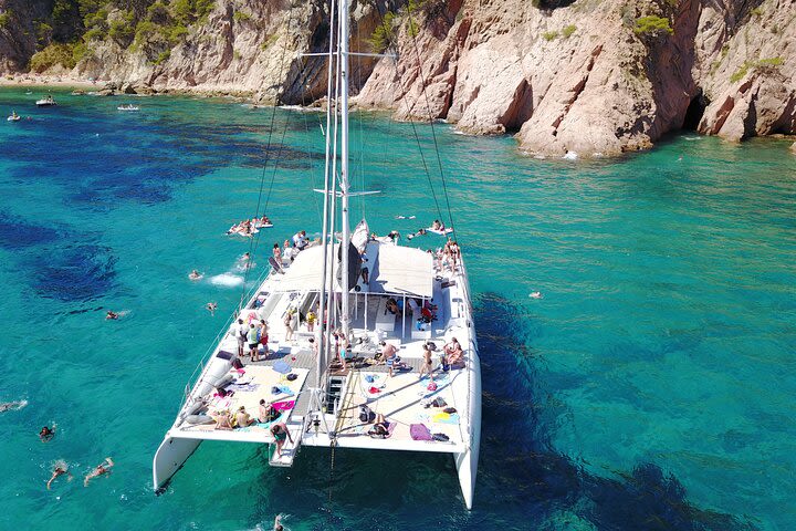 Sailing along the Costa Brava in a big Catamarán with buffet-barbacue and bathing inlet. Drinks included. image