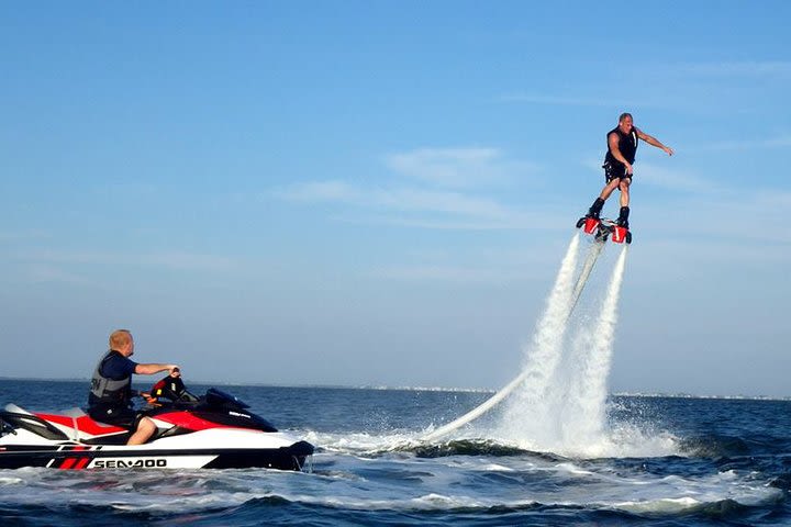 Actively enjoy marine sports! Popular fly board + selectable marine sports (parasailing + jet ski + banana boat etc.) Round trip hotel transfer included image