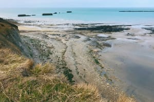 Concrete Mulberry Harbour caissons in the sea off Arromanches beach