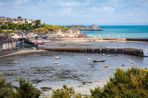 Cancale fishing harbor with oyster beds visible at low tide
