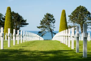 Normandy American Cemetery and white crosses overlooking Omaha Beach visited during a D-Day tour from Bayeux