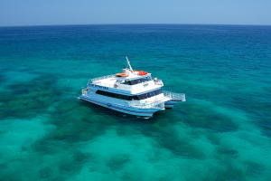 Fury Glass Bottom Boat Catamaran at Florida Keys Reef in crystal blue green water