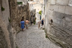 Stone streets and historic buildings in Les Baux-de-Provence explored during a day trip from Aix