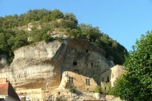 Limestone cliff overhangs and prehistoric cave dwellings at Les Eyzies-de-Tayac, the prehistoric capital of the world, in the Dordogne