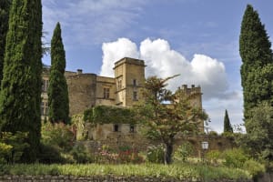 Historic Renaissance Château de Lourmarin castle with stone towers and courtyard in Lourmarin village Luberon Provence France