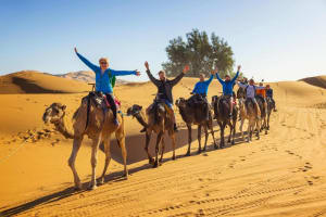 A camel Caravan in Merzouga desert during the 9 day Morocco tour from Tangier