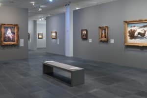 Paintings displayed in a gallery inside the Orangerie Museum