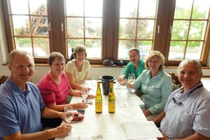 Glasses of white Alsace wine on a wooden tasting table