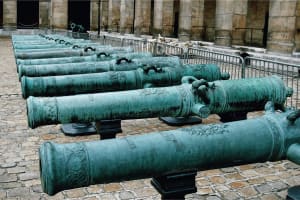 Historic cannons lined up in the courtyard of Les Invalides in Paris