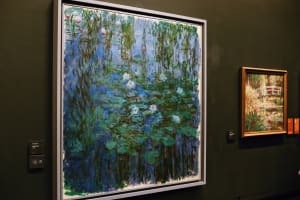 Large blue and green Impressionist painting displayed at Musée d’Orsay