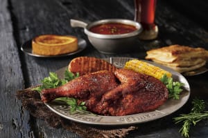 Dinner showing chicken, corn, potato, soup and bread from Medieval Times 