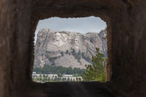 Doane Robinson Tunnel on Iron Mountain Road with a view of Mt Rushmore