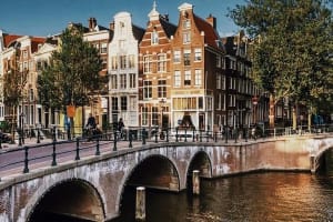 Canal bridge and gabled houses in Amsterdam