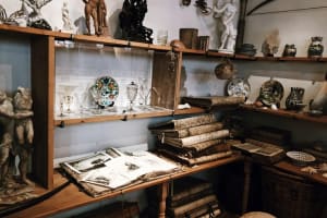 Shelves of decorative objects and books inside the Rembrandt House Museum