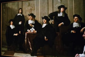 Painting of several Dutch figures dressed in black at the Rijksmuseum