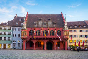 Red Merchants’ Hall with arcades and towers on Freiburg’s main square