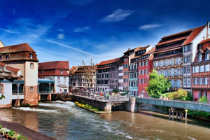 Colorful riverside buildings and bridges in Strasbourg’s Petite France district